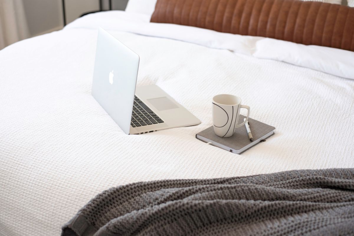 laptop on the bed