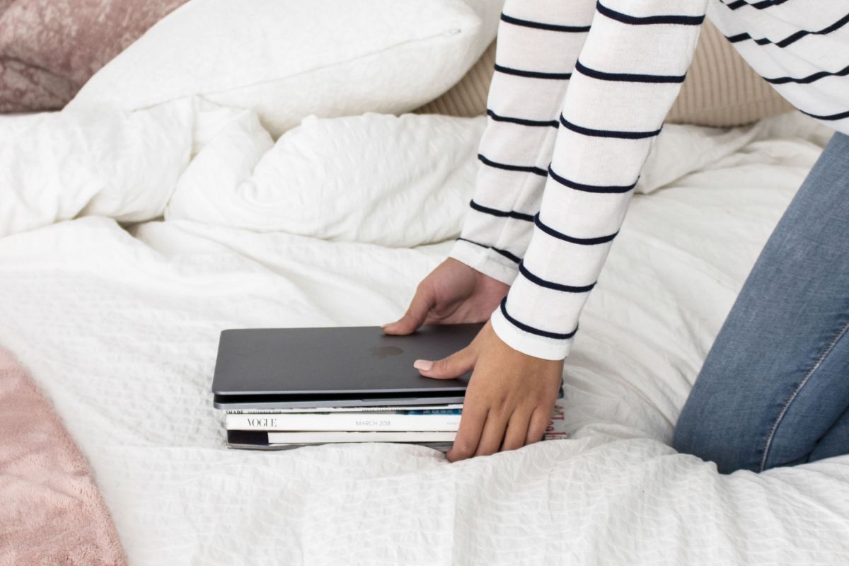 stack of books and laptop