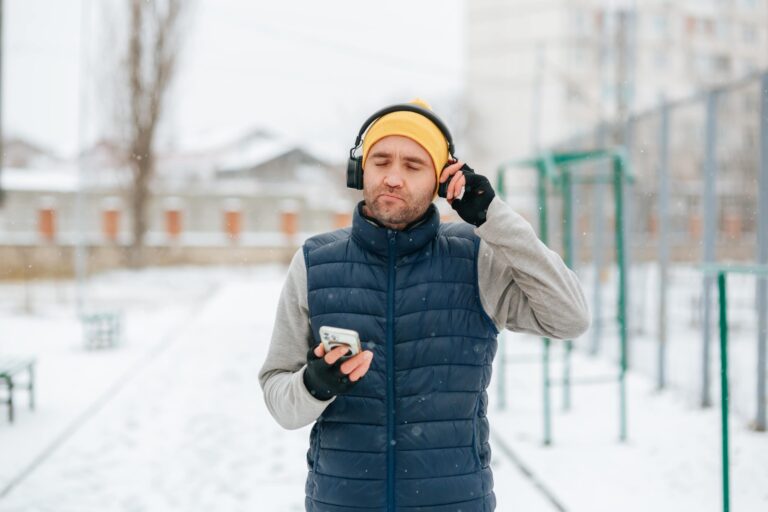 man with headphones and a phone